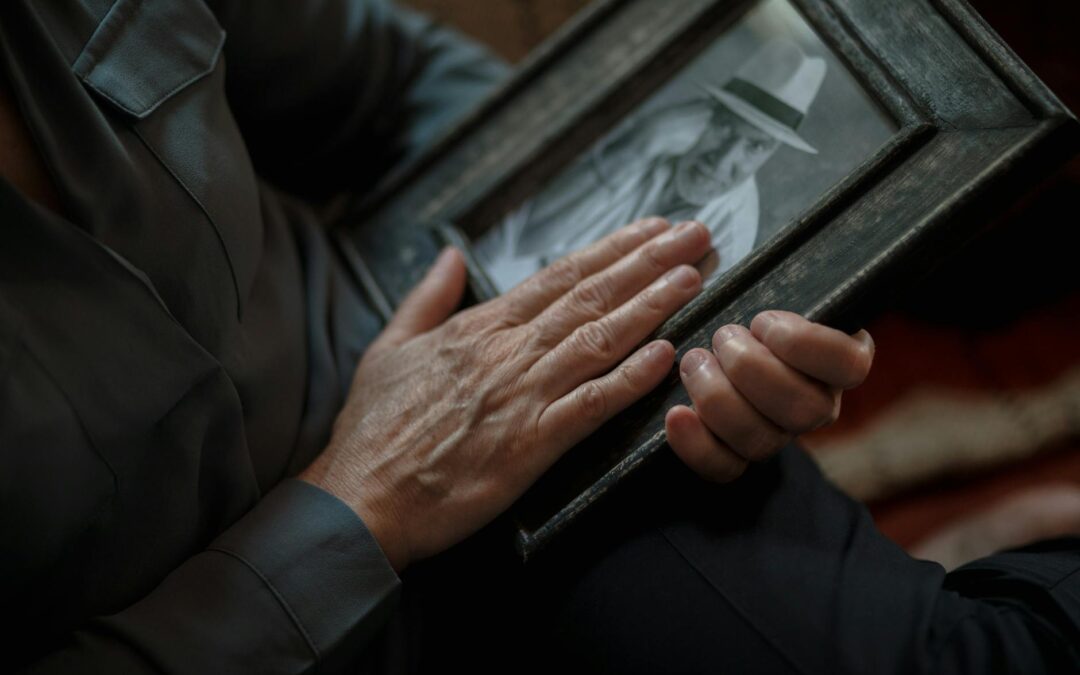 close up shot of a person holding a picture frame