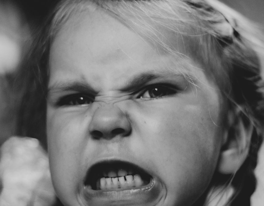 young girl with an angry face